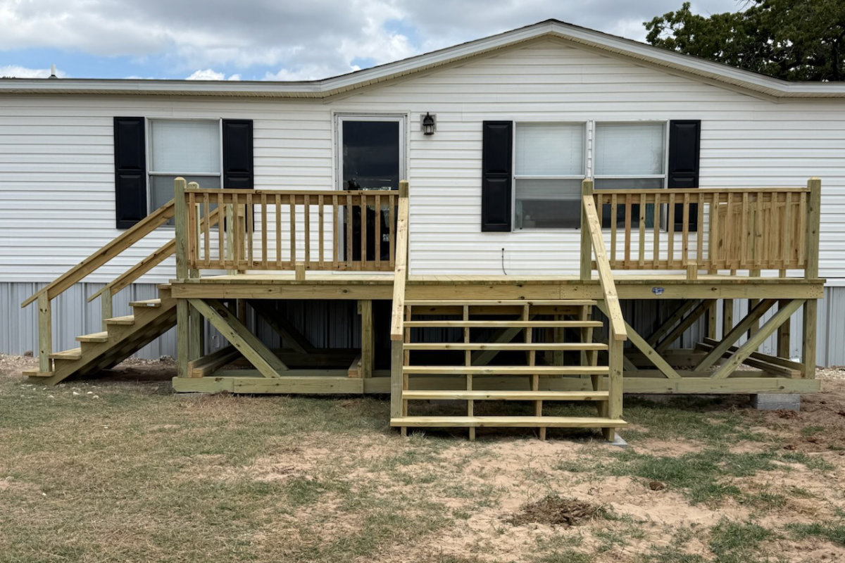 New pressure-treated deck with two stair landings