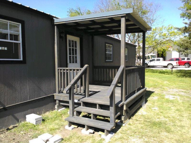 Compact charcoal portable deck with shed roof and handrails