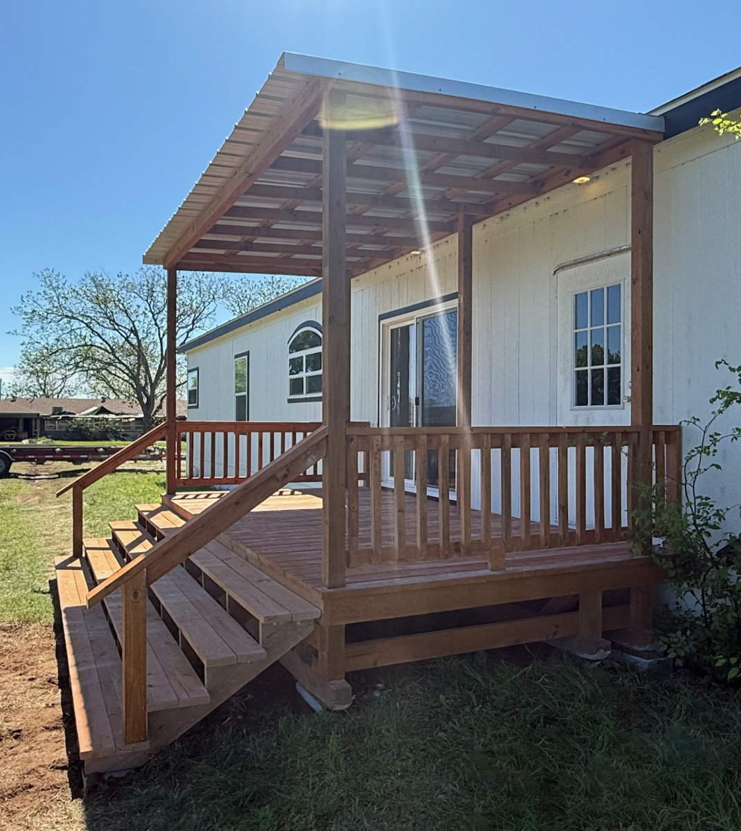 Large covered natural-finish portable deck