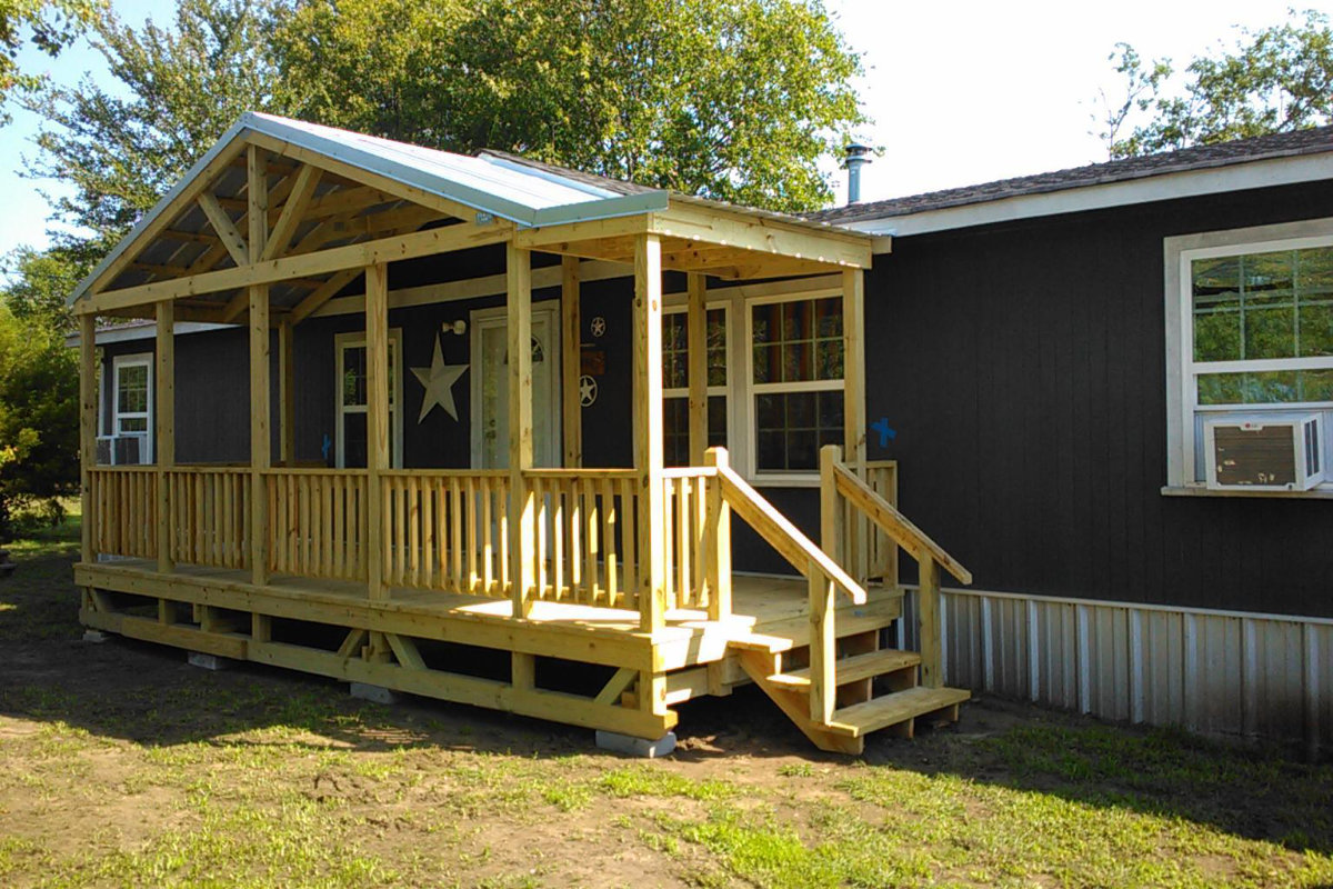 Large light wood covered portable deck with gabled roof