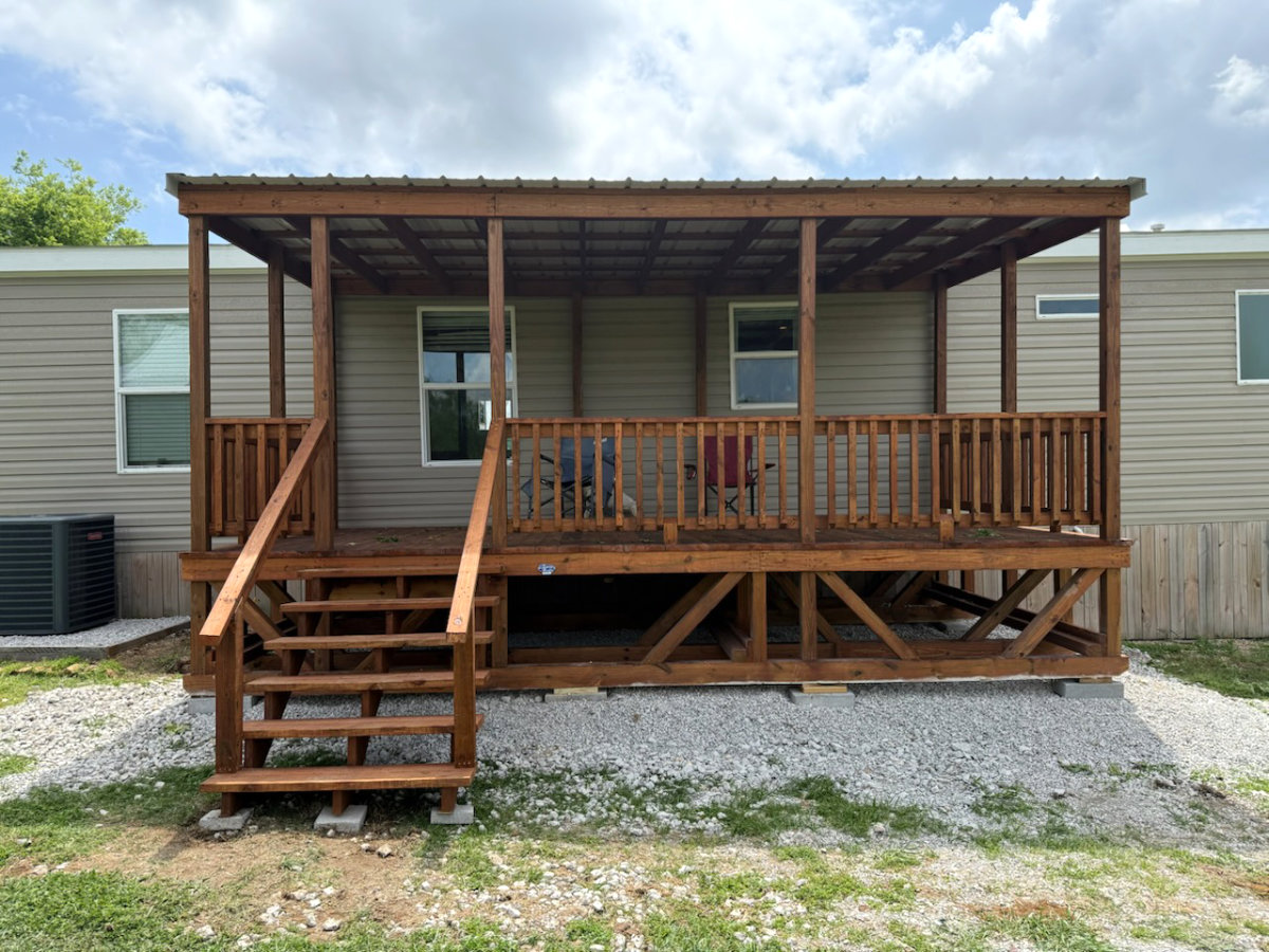 Covered portable deck installed beside a Texas home